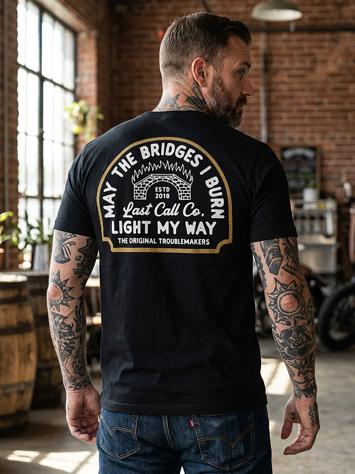 Last Call Co Burn Badge Graphic T-Shirt Black lifestyle back view featuring grim reaper and Burn the Bridges Behind You back graphic
