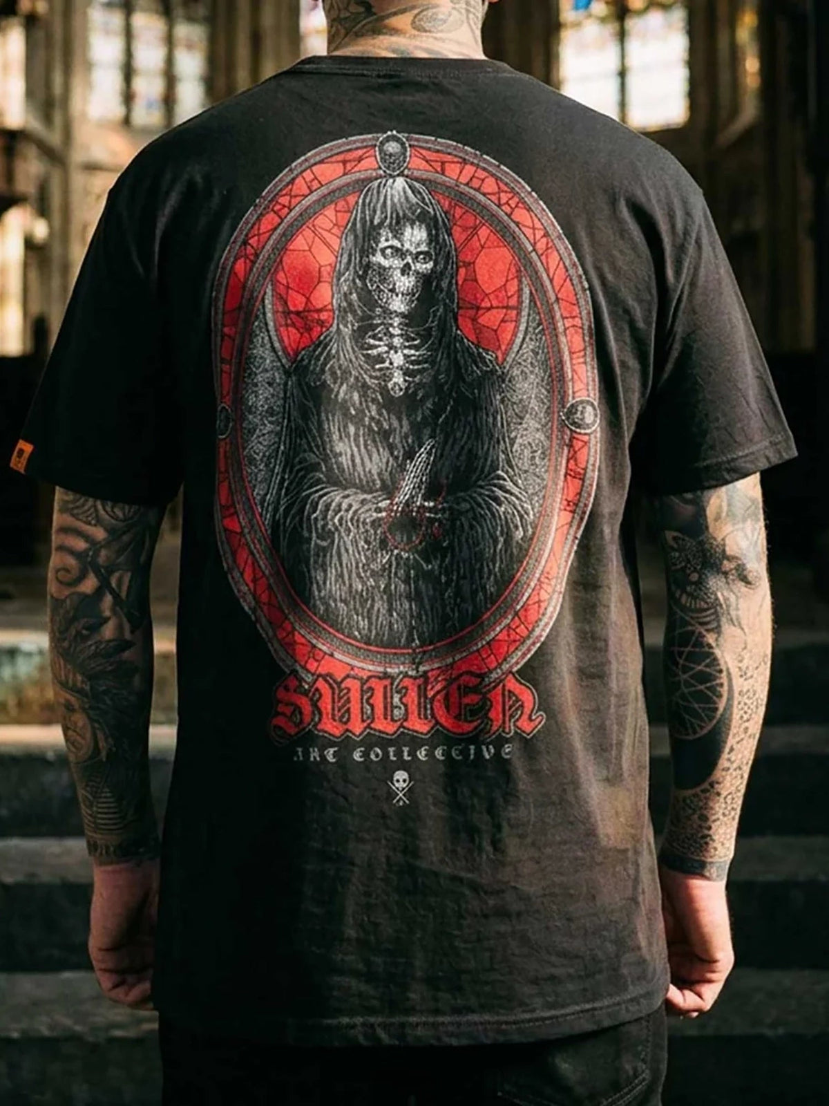 Styled back view of the black Sullen Divine Reaper T-shirt and reaper print
