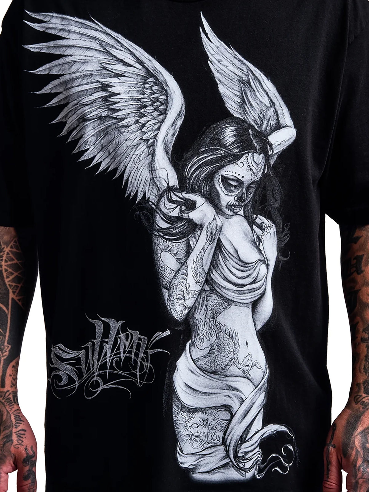 Close-up of Fallen Angel winged tattoo artwork on the Sullen 1 Ton black T-shirt