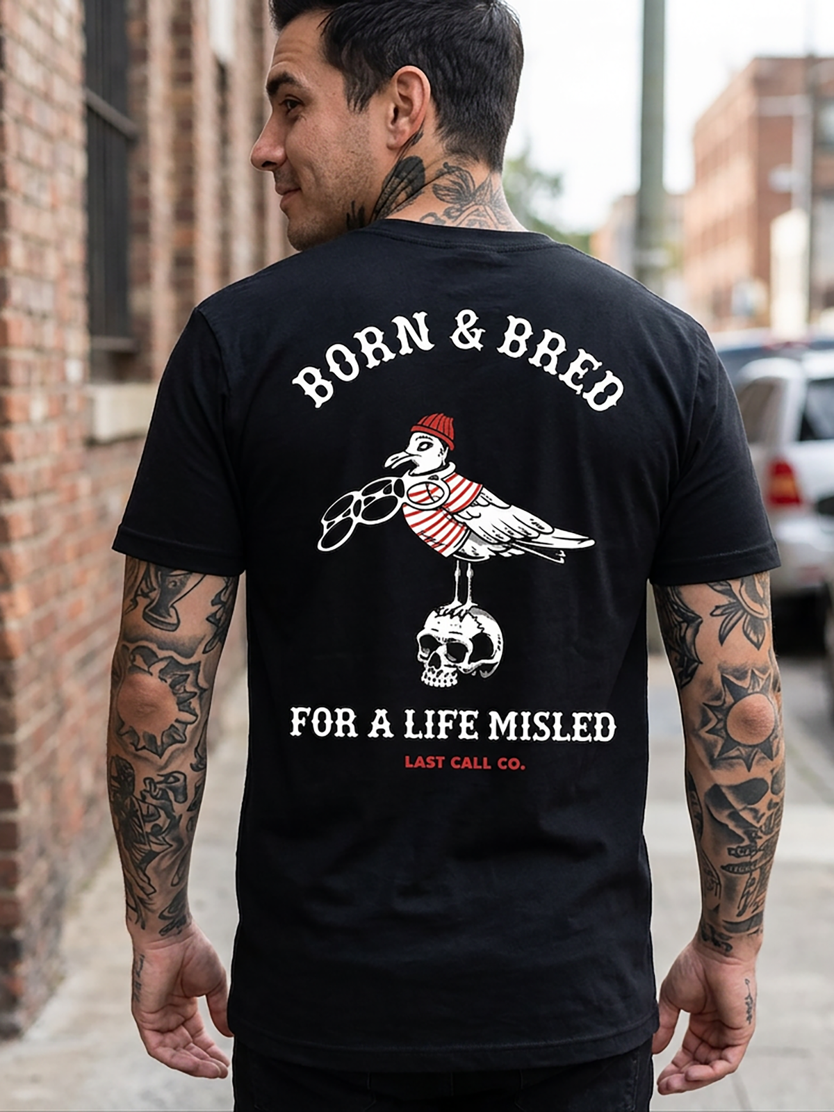 Last Call Co Misled Graphic T-Shirt Black lifestyle back view featuring devil woman and Misled by the Devil back graphic