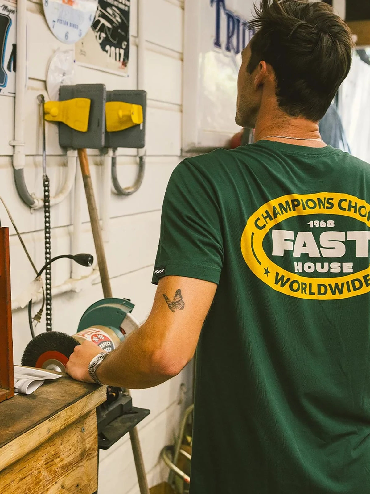 Fasthouse Men's Petrol Graphic T-shirt in Forest Green, lifestyle view showing the back graphic