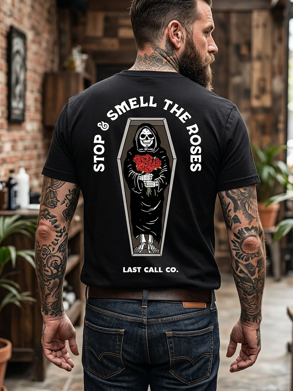 Last Call Co Roses 2 Graphic T-Shirt Black lifestyle back view featuring hand holding a red rose back graphic