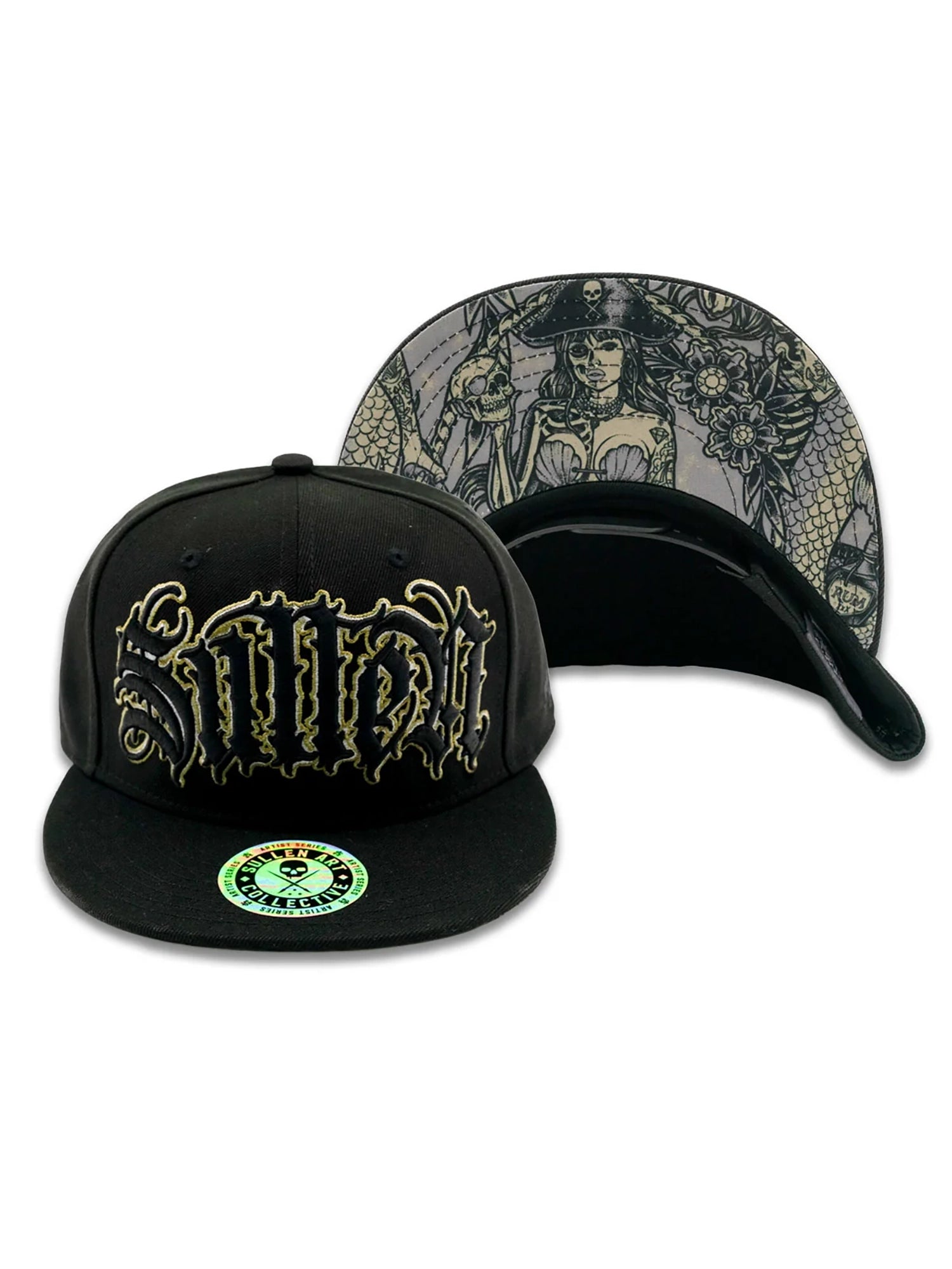 A black flat-brim cap shown from the front and back on a white background. The front features a large stylized metallic gold logo, and the back displays a detailed gothic pirate-themed illustration in muted gray, black, and gold tones.