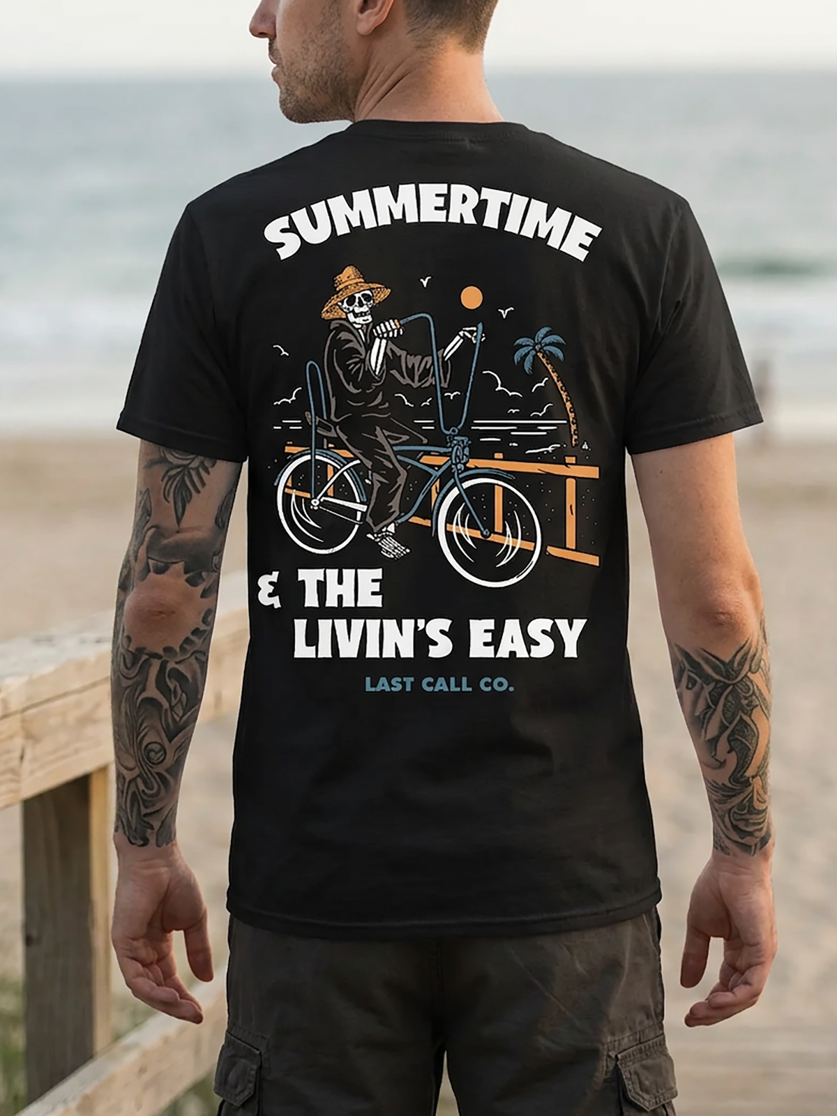 Last Call Co Summertime Graphic T-Shirt Black lifestyle back view featuring skeleton rider and Summertime Cruisin' and Boozin' back graphic