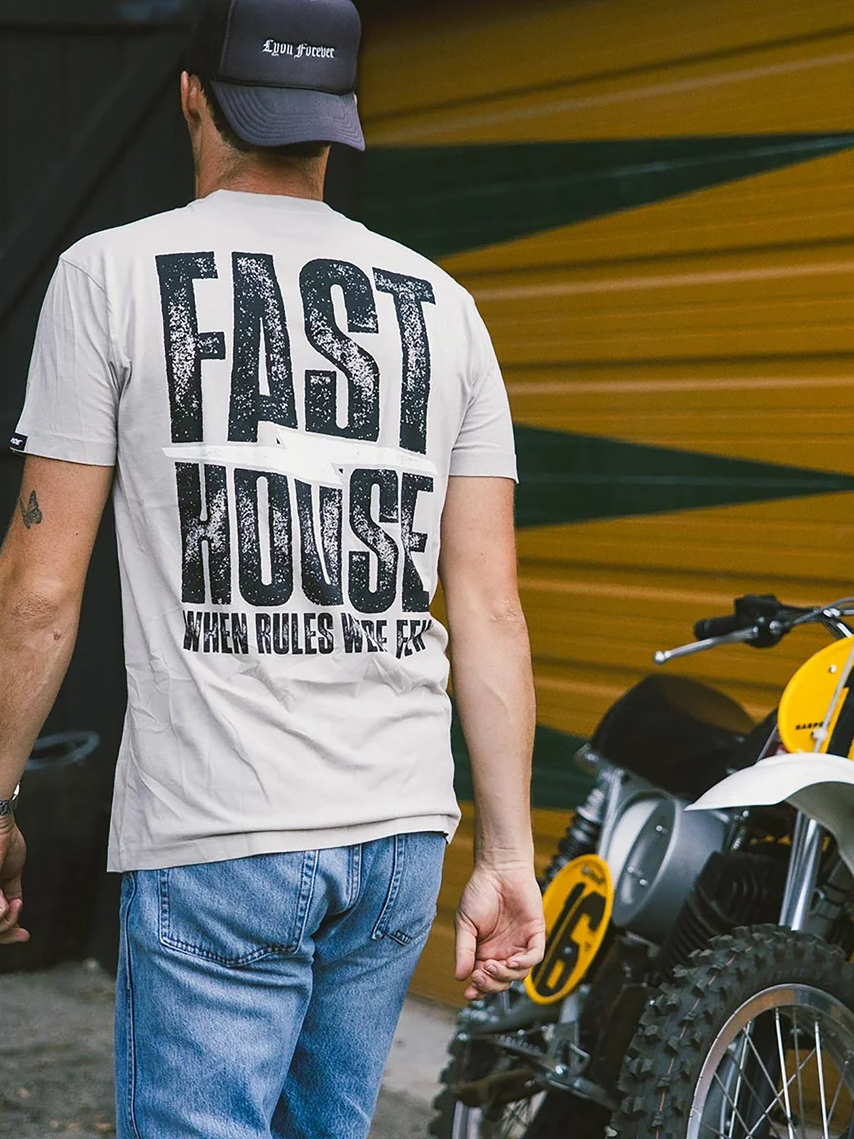 Fasthouse Men's Surge Graphic T-shirt in Light Gray, lifestyle view showing the back graphic