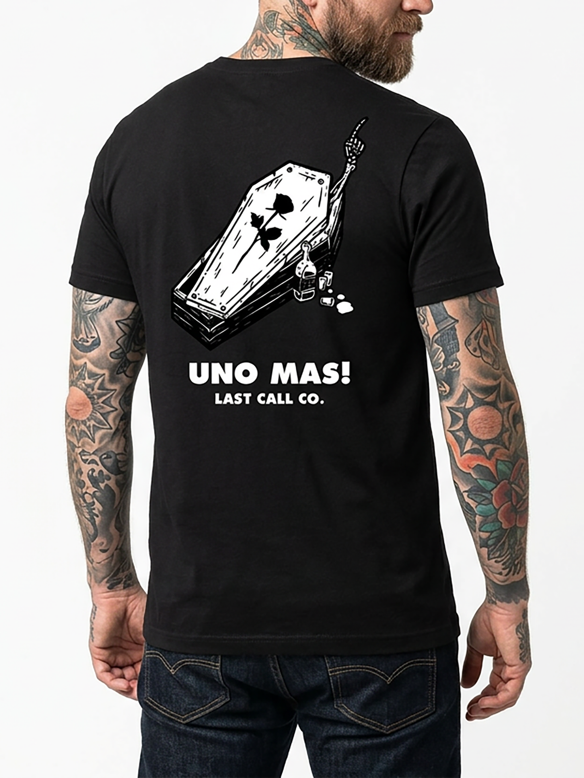 Last Call Co Uno Mas Graphic T-Shirt Black on-model back view featuring raised drink glasses, a skeletal hand, and Uno Mas One More Always De Nada artwork
