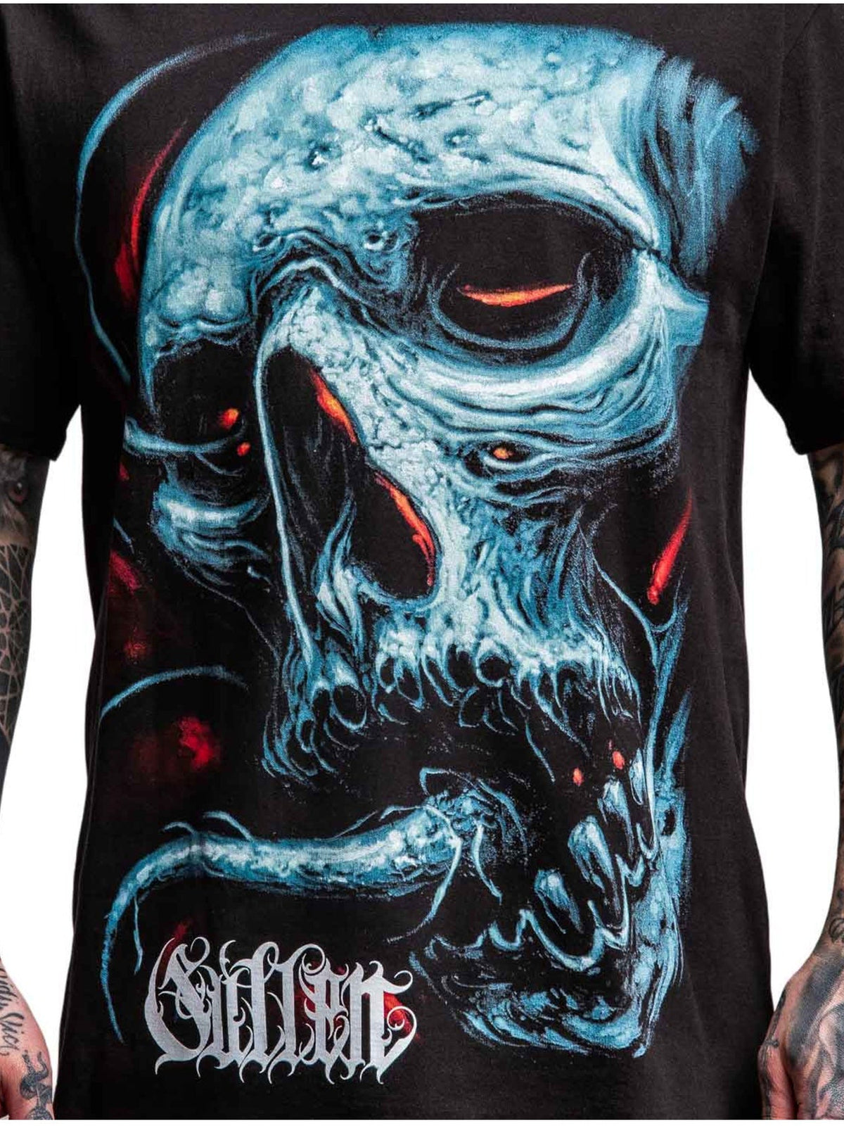 Close-up of the Taste blue decayed skull, red accents and tongue graphic