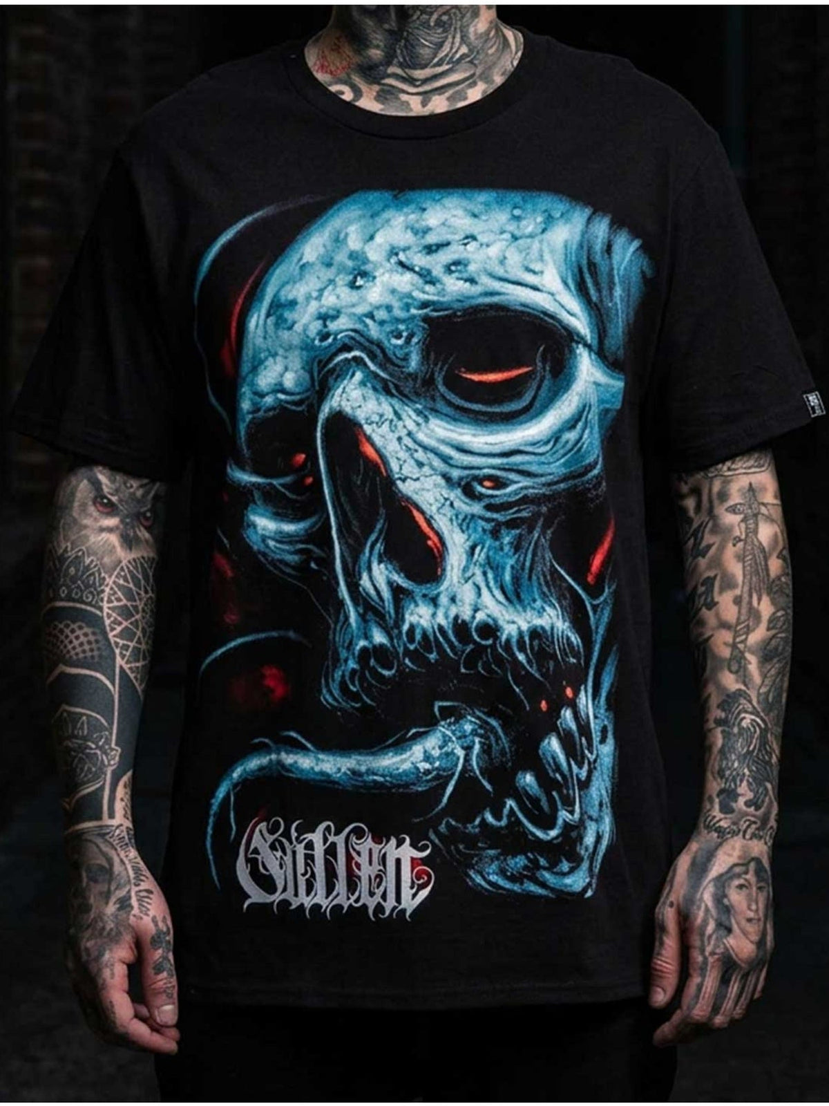 Styled front view of the Sullen Taste 1 Ton Caviar T-shirt with oversized blue skull artwork