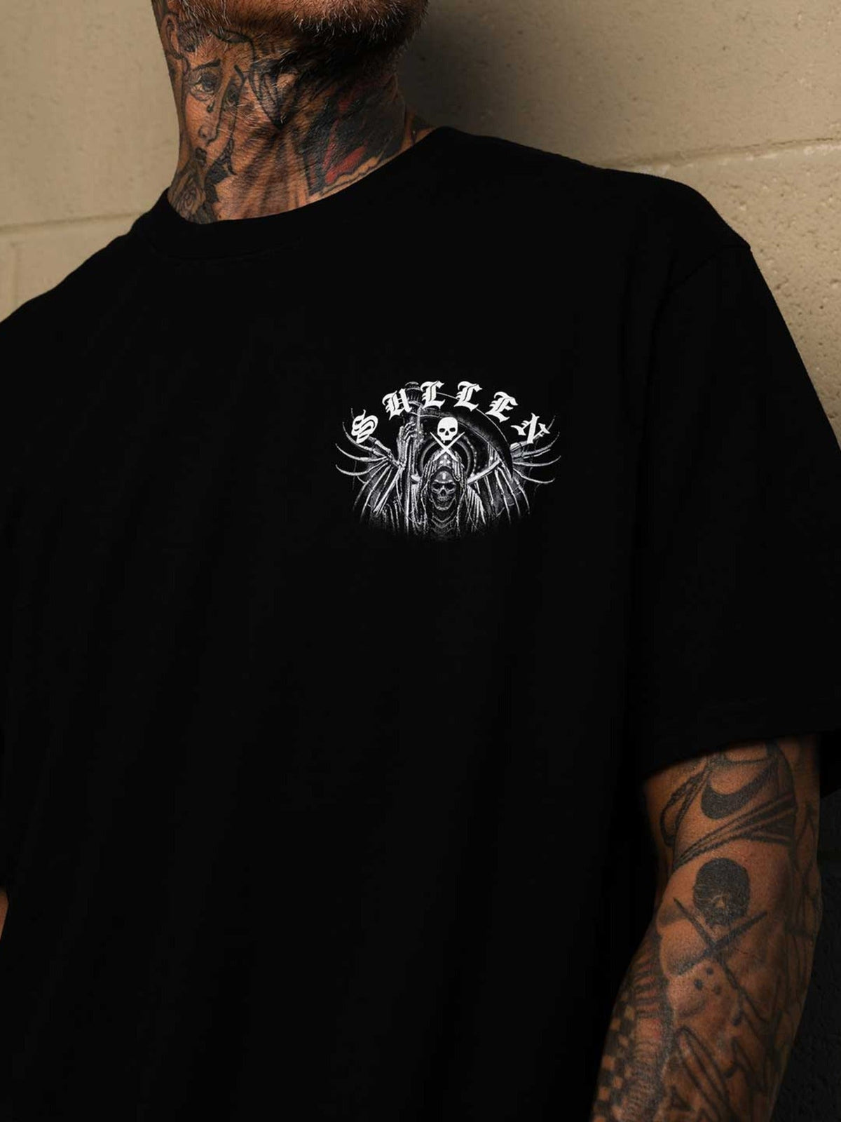 Front lifestyle view of the Sullen Hodu Reaper premium tee in Jet Black