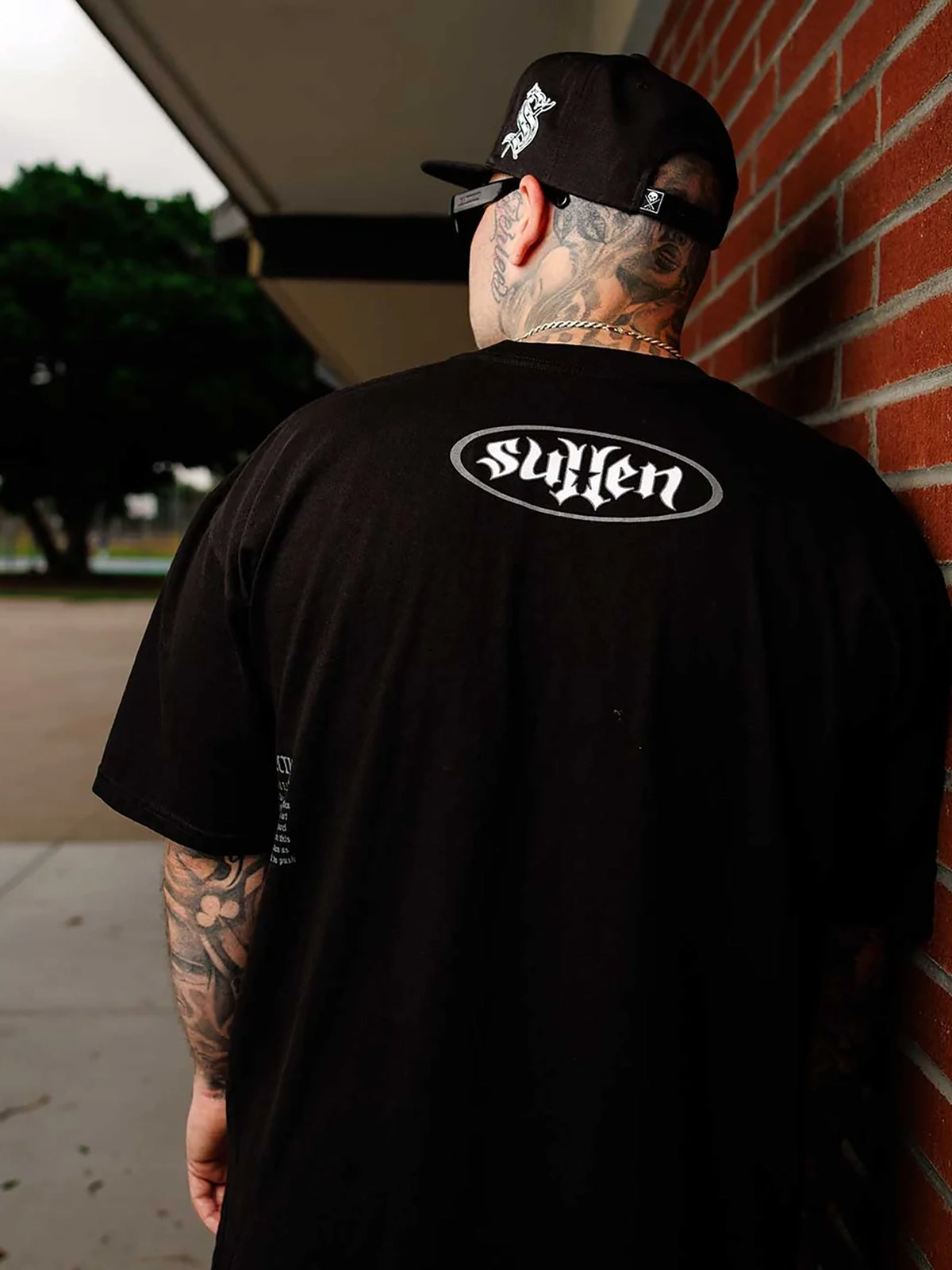 Male model wearing Jet Black Sullen Bone Thug 1 Ton T-shirt - back view
