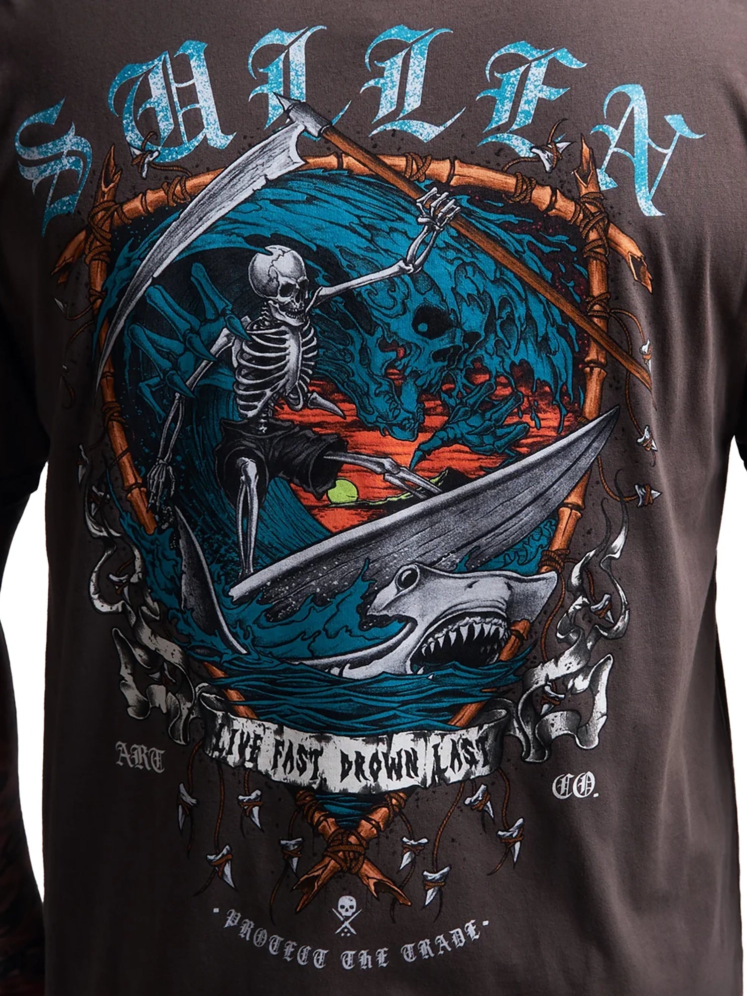 Close-up of a dark brown graphic t-shirt featuring a detailed grim reaper design with a scythe, shark, and blue ocean background, with the brand name 'SMILEA' printed at the top.