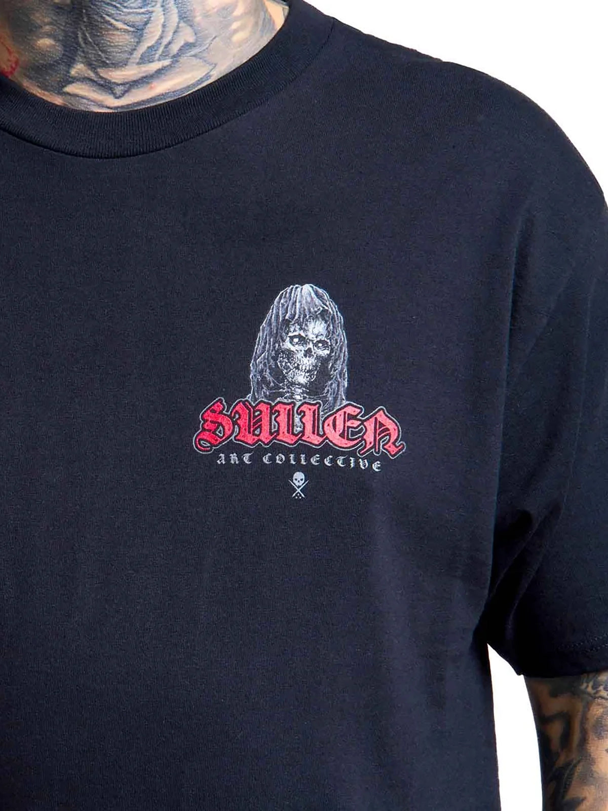 Close-up of the small Divine Reaper hooded skull chest graphic