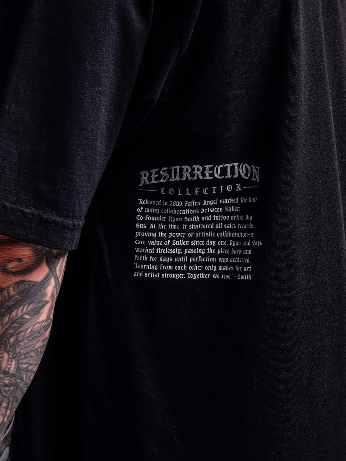 Close-up of Resurrection Collection story print on the Sullen Fallen Angel black T-shirt