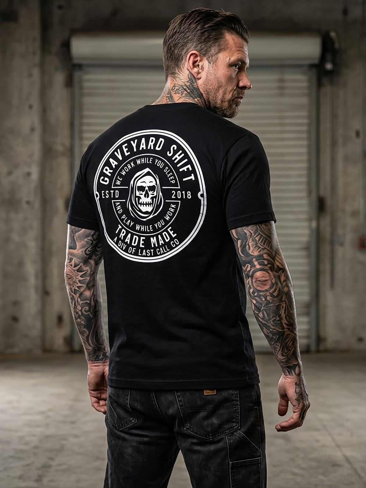 Last Call Co Graveyard Shift Trademade Graphic T-Shirt Black lifestyle back view featuring hooded skull and Graveyard Shift Trade Made back graphic
