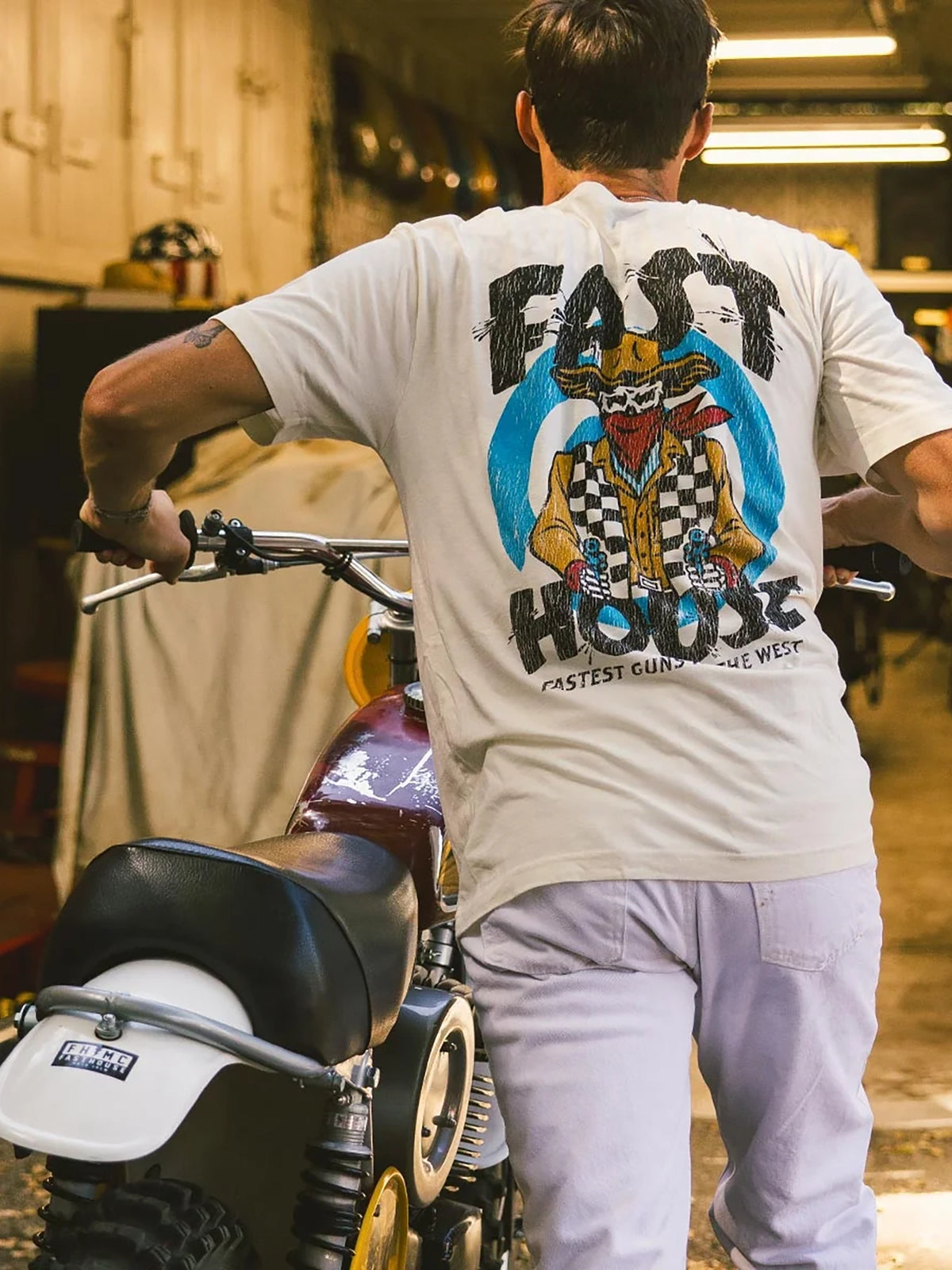 Fasthouse Men's Hyde Graphic T-shirt in Natural, alternate lifestyle view showing the back graphic