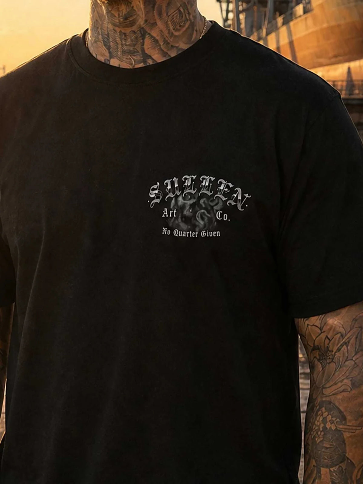 Model wearing the front of the Sullen No Quarter Premium T-shirt in Caviar