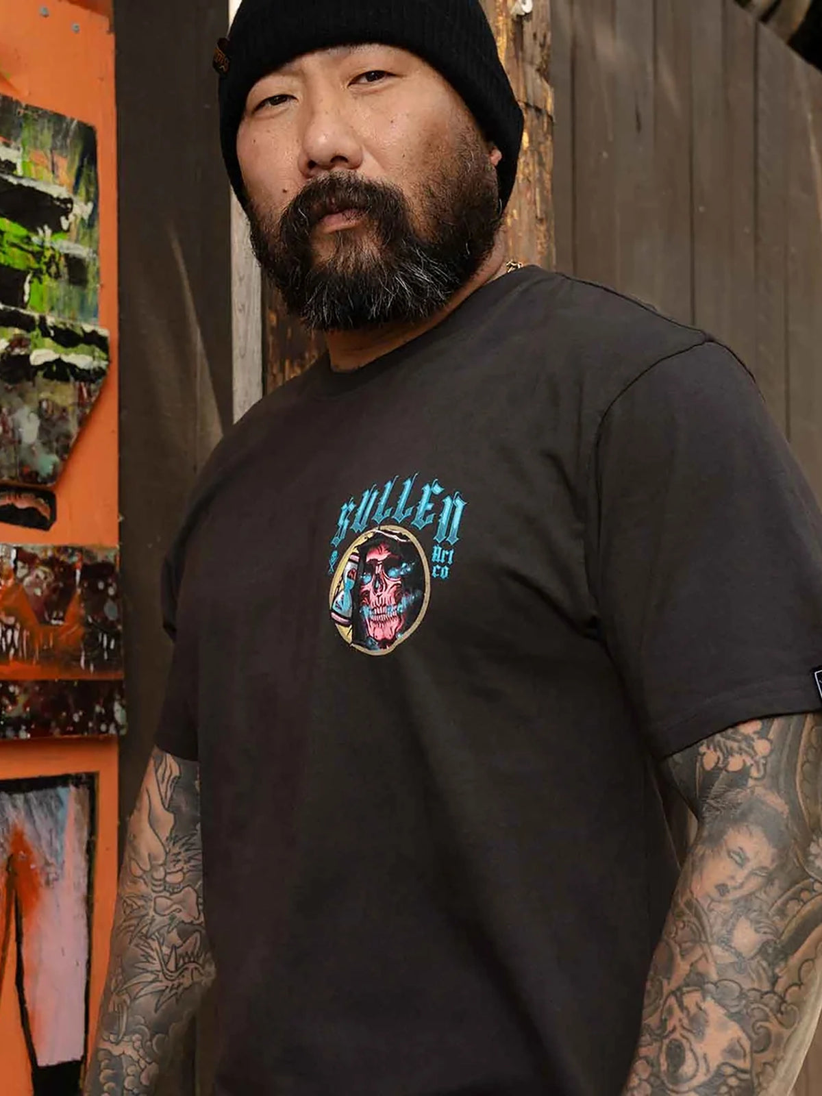 Model wearing the front of the Sullen Red Reaper Premium T-shirt in Vintage Black