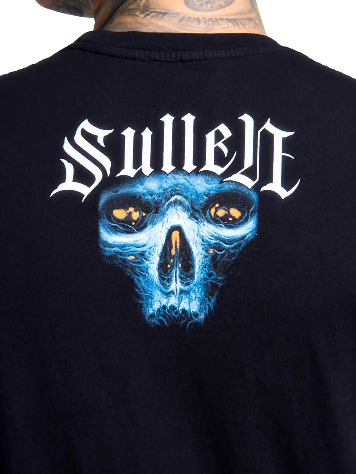 Close-up of the small Ruh Neb skull graphic on the upper back