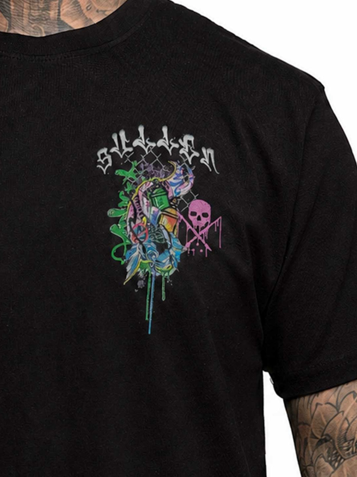 Detail of the small multicolor skull chest print and crew neckline on the Chemical Swirl Premium Tee