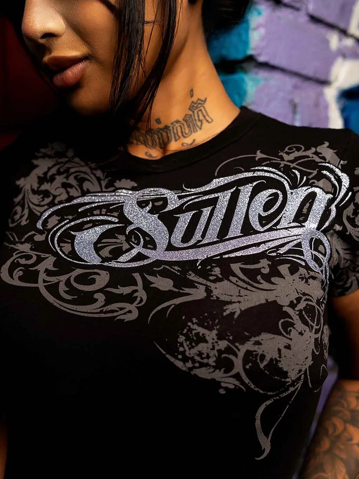 Close-up lifestyle view of Sullen Swoop women's Jet Black graphic T-shirt