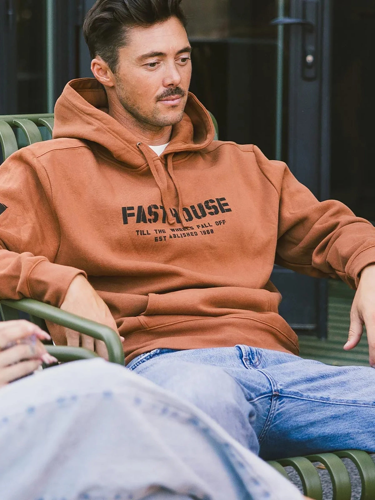 Fasthouse Men's Torn Pullover Hoodie in Rust, front lifestyle view