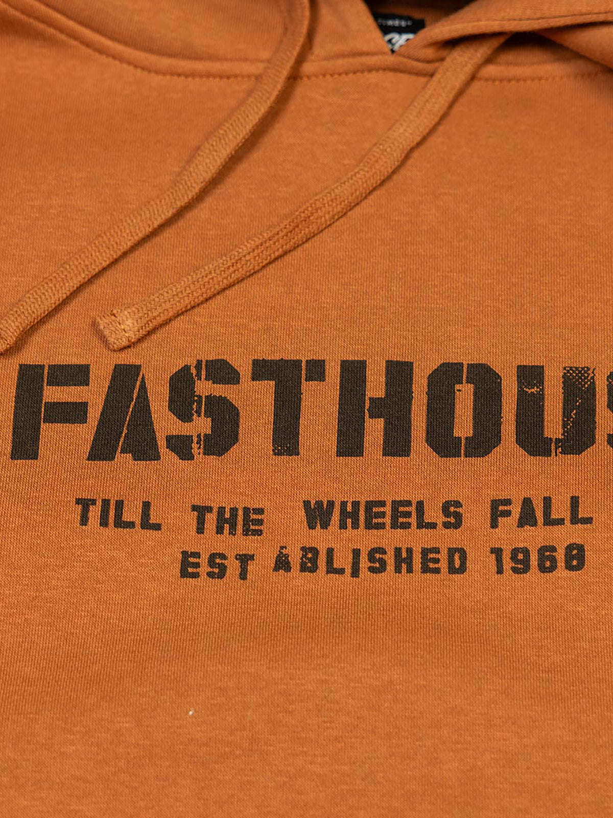 Fasthouse Men's Torn Pullover Hoodie in Rust, close-up of the front chest graphic