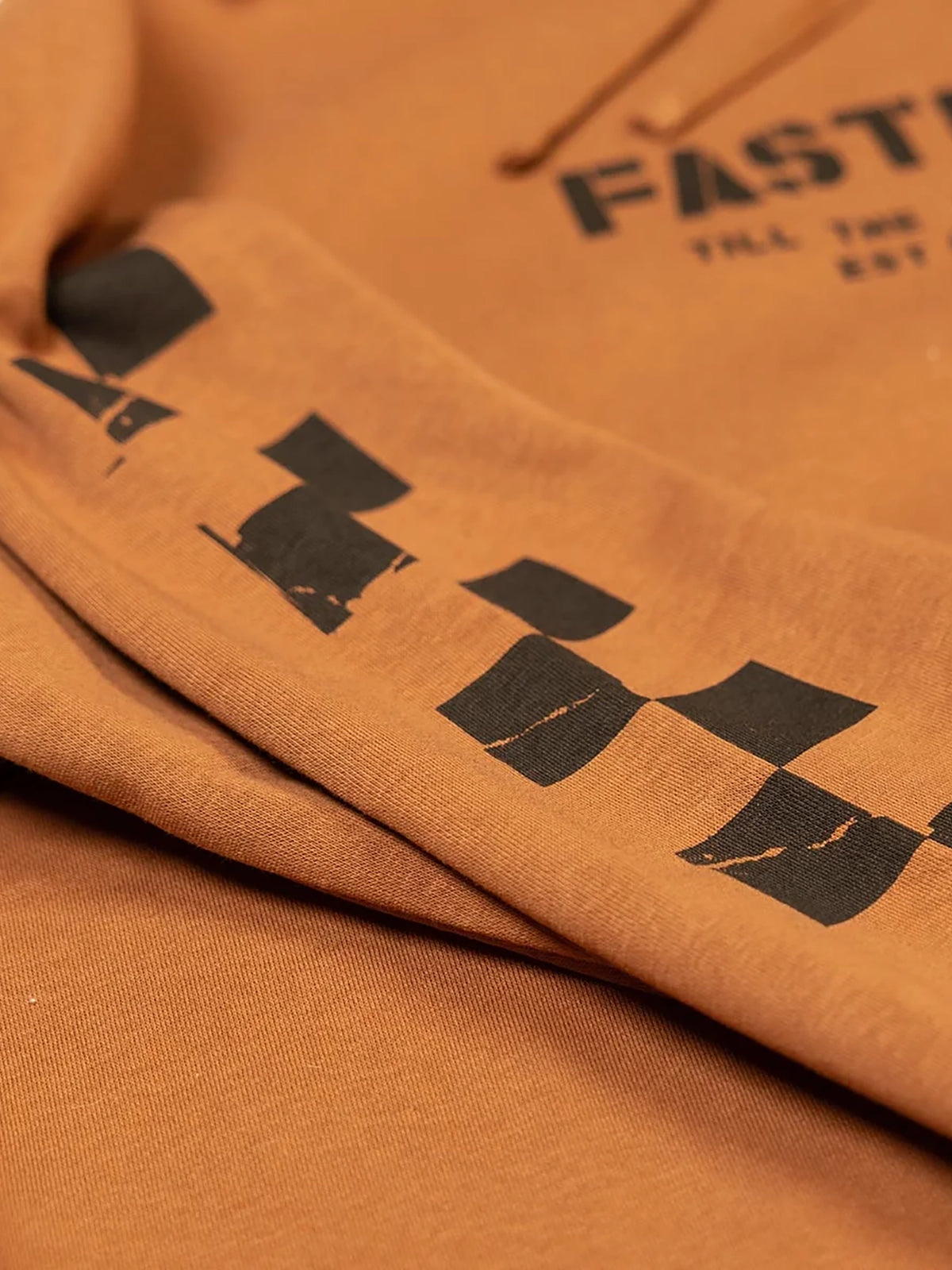 Fasthouse Men's Torn Pullover Hoodie in Rust, close-up of sleeve detail