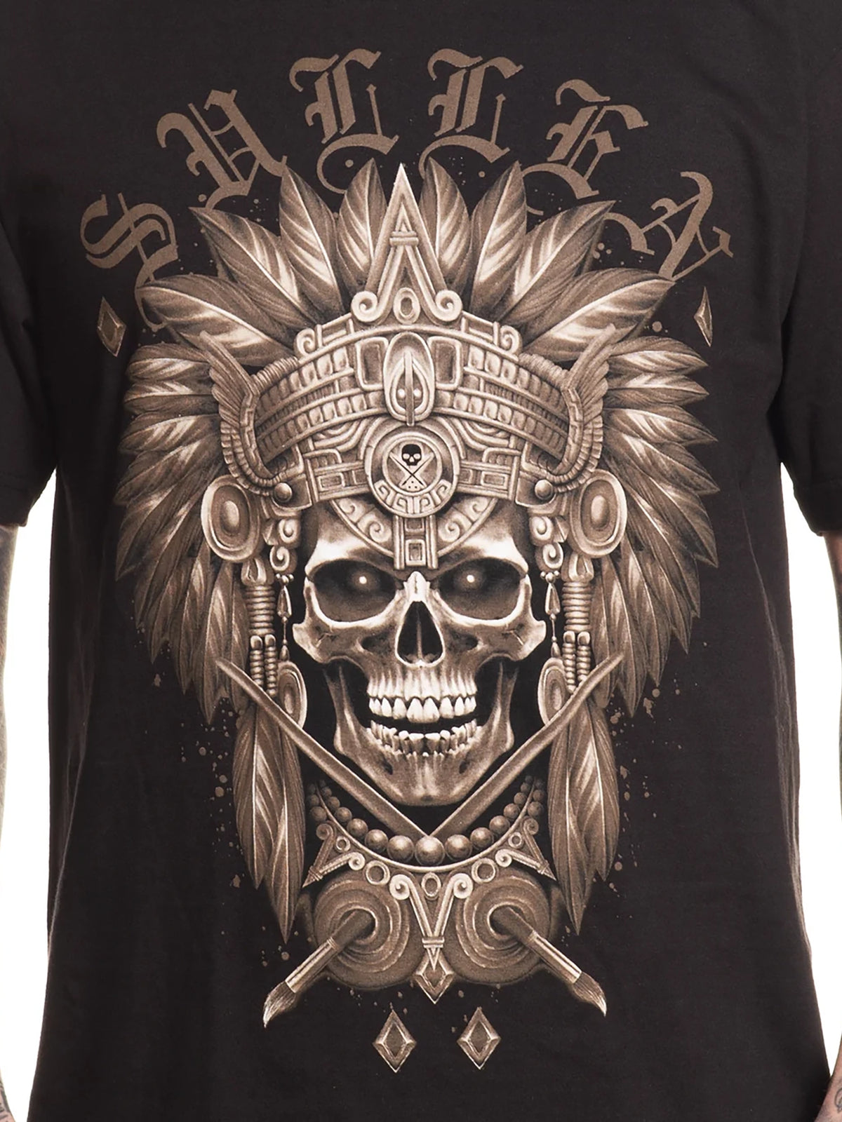 Close-up of the bronze warrior skull front graphic on the Sullen Warrior T-shirt