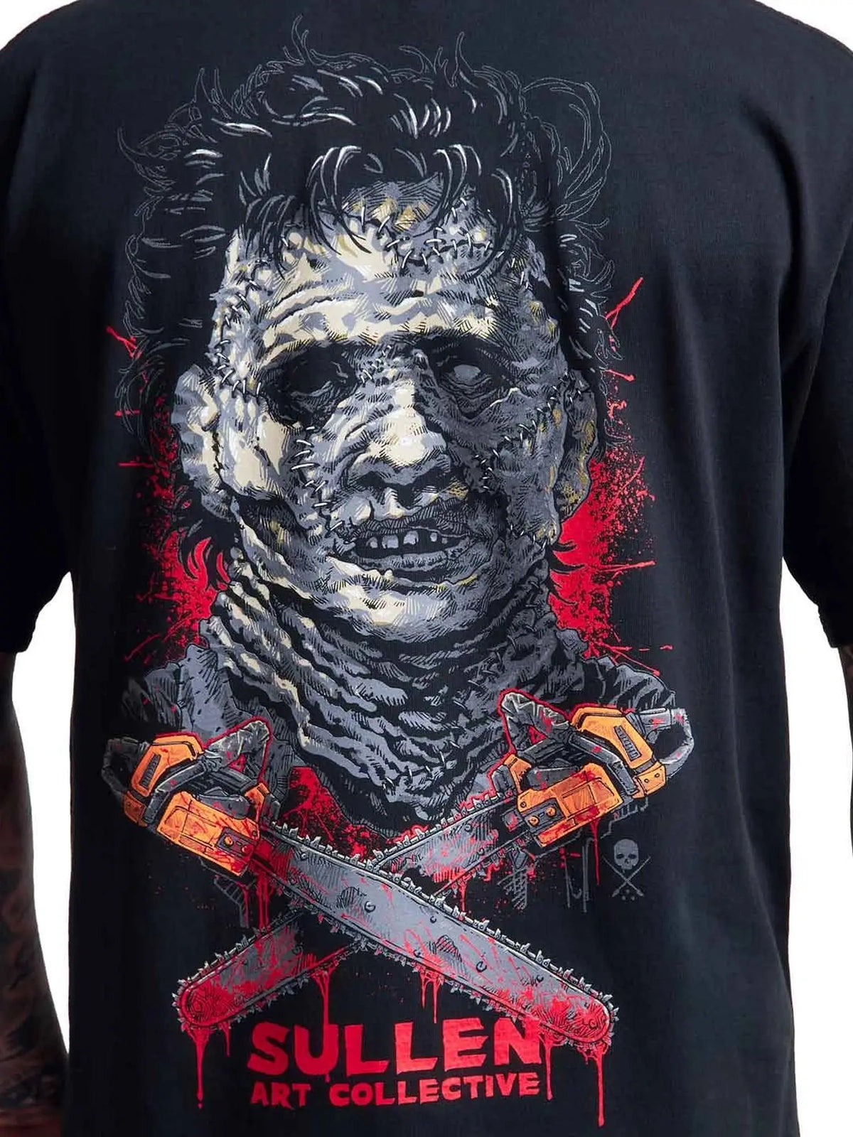 Close-up of the Chainsaw Badge masked horror character back artwork